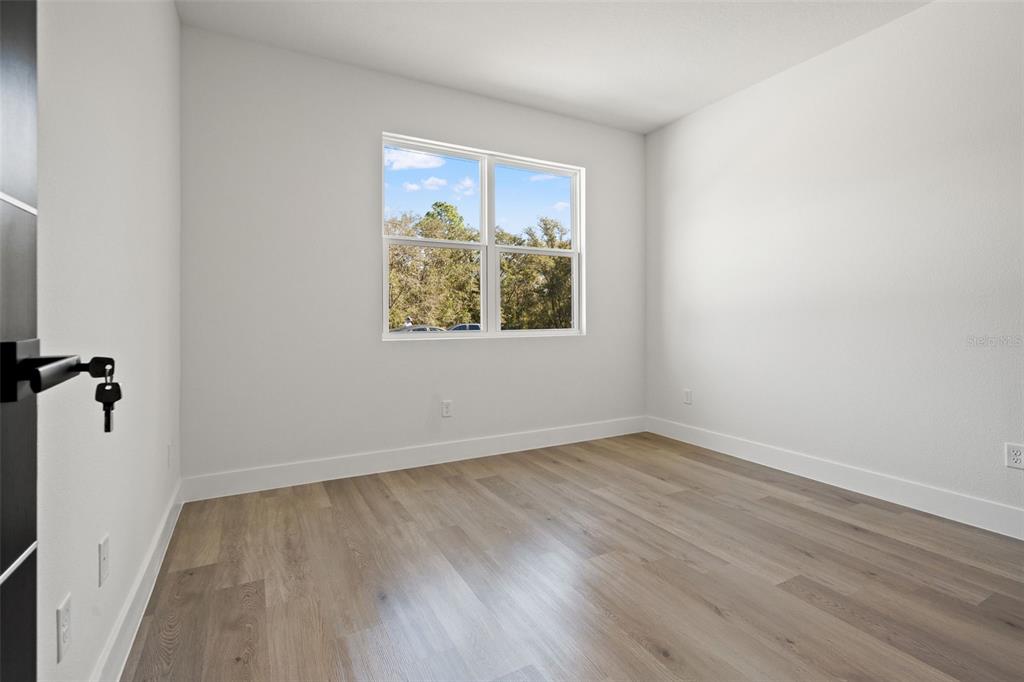 11810 North Providence Way Citrus Springs, FL 34433 - Photo 35 of 53 an empty room with a window