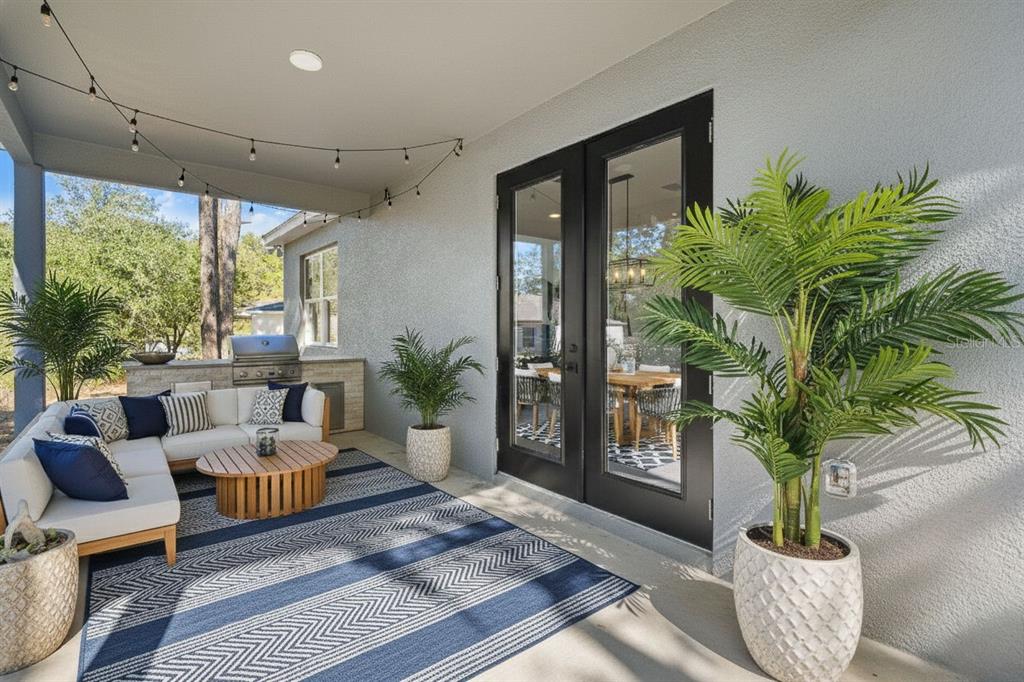 11810 North Providence Way Citrus Springs, FL 34433 - Photo 44 of 53 a living room with furniture potted plant and a large window