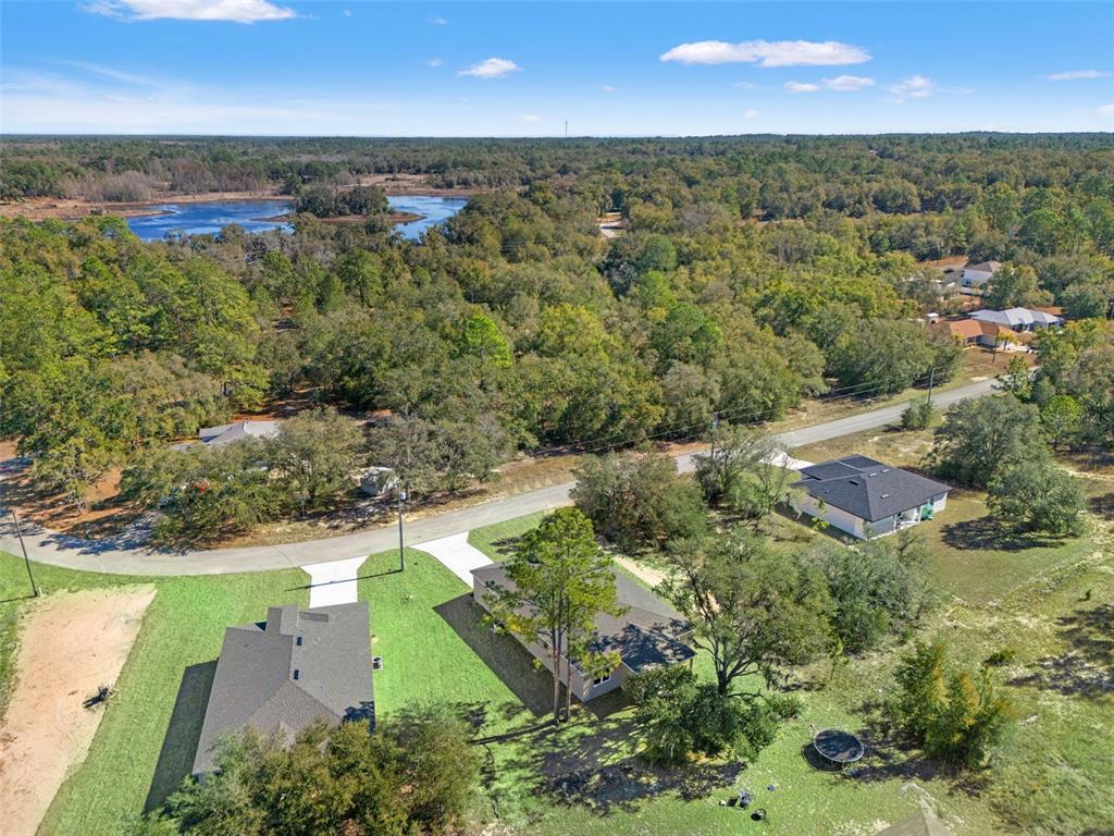 11810 North Providence Way Citrus Springs, FL 34433 - Photo 5 of 53 an aerial view of residential houses with outdoor space and trees