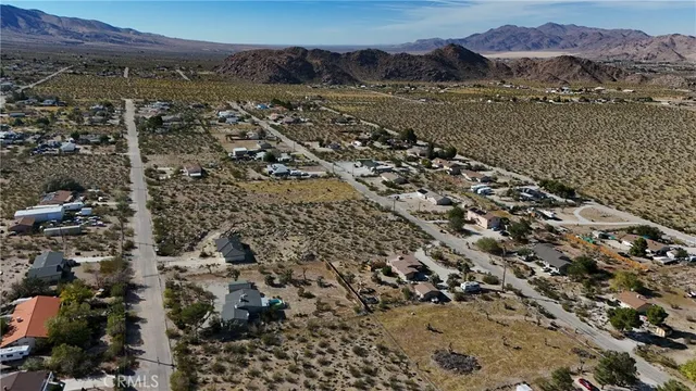 a view of a city with mountains in the background