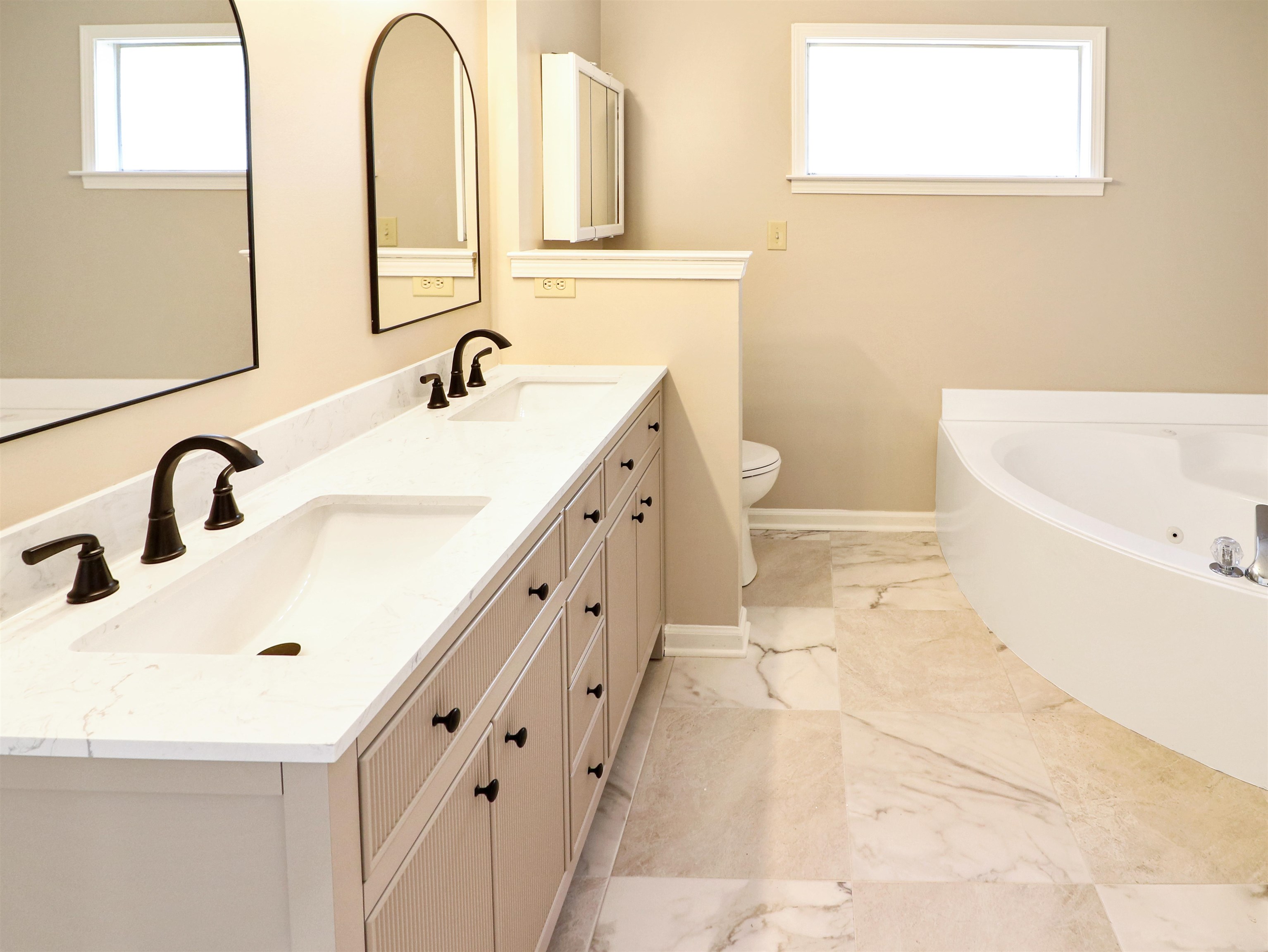 2321 Valley Edge Cove Memphis, TN 38016 - Photo 11 of 18 a bathroom with a double vanity sink and a bathtub