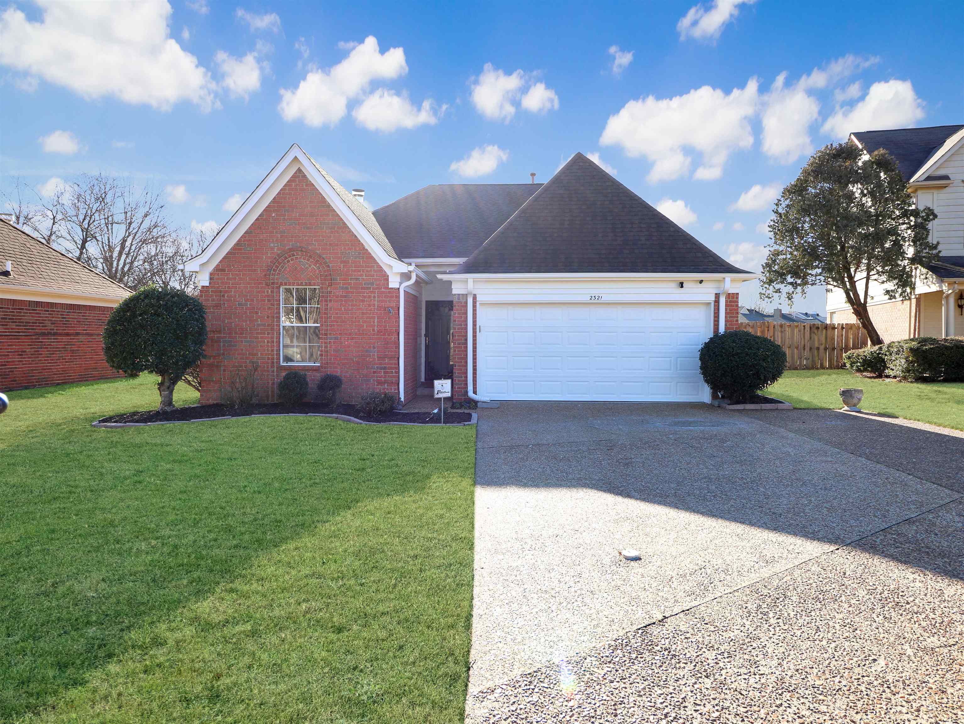 2321 Valley Edge Cove Memphis, TN 38016 - Photo 2 of 18 a front view of a house with garden
