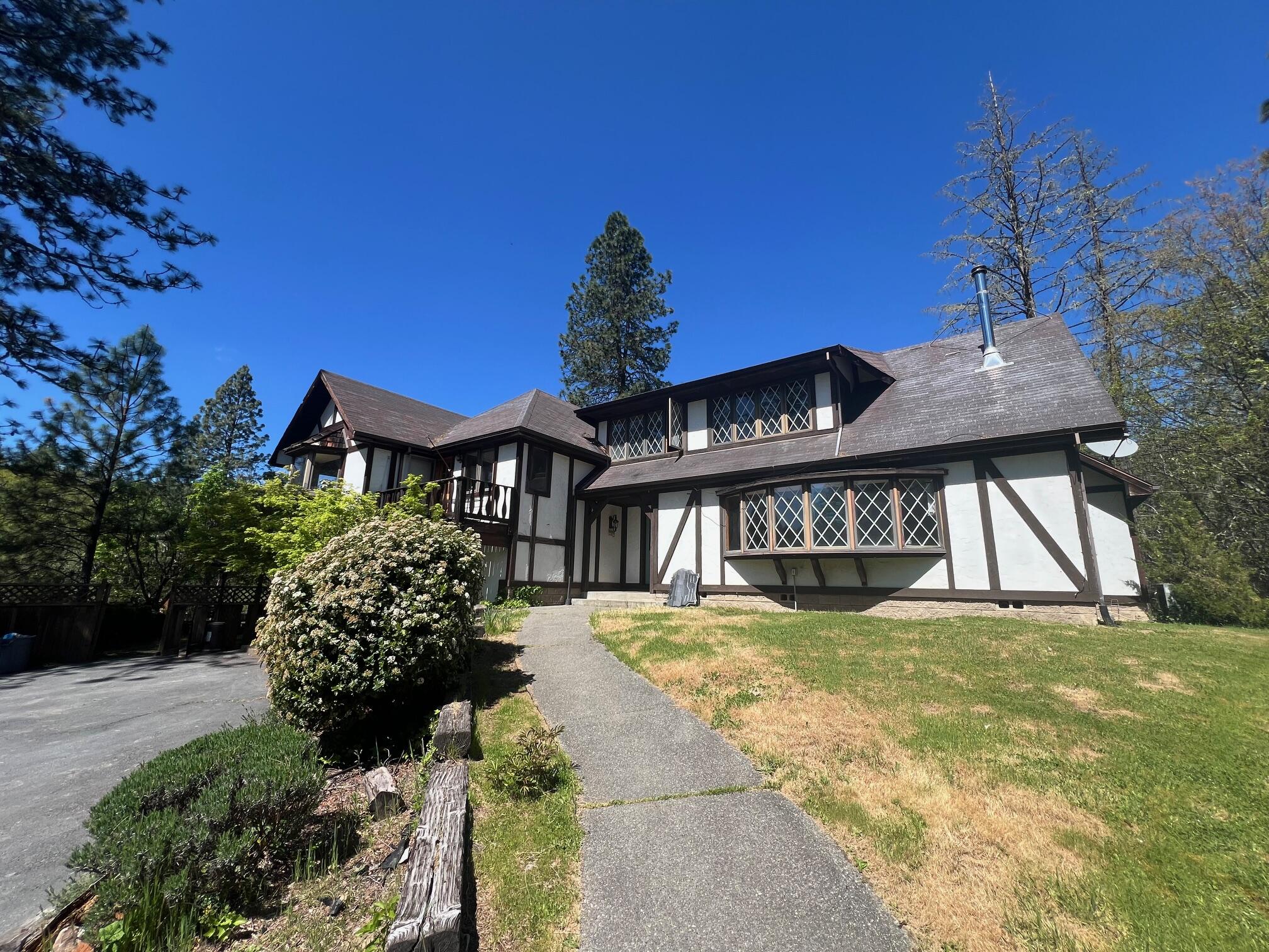 4196 East Evans Creek Road Rogue River, OR 97537 - Photo 2 of 36 a view of a house with a yard