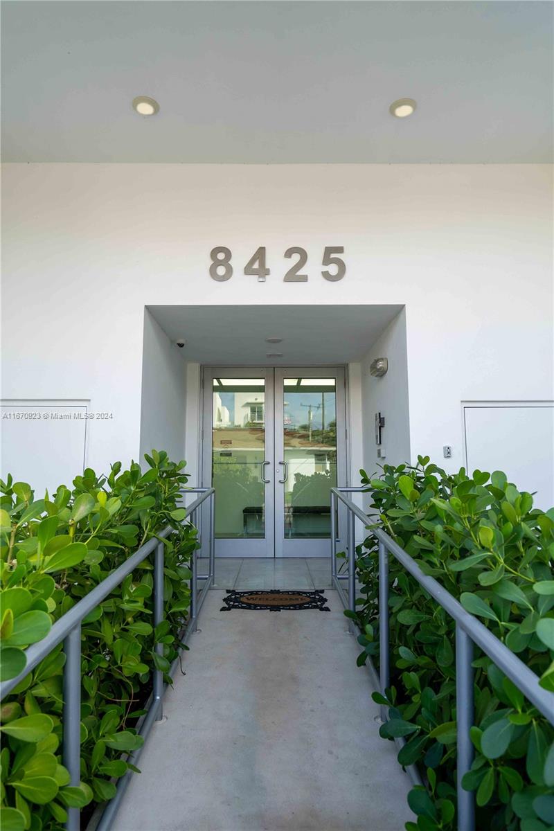 8425 Crespi Boulevard, Unit TH4 Miami Beach, FL 33141 - Photo 2 of 26 a view of a room with lots of plants