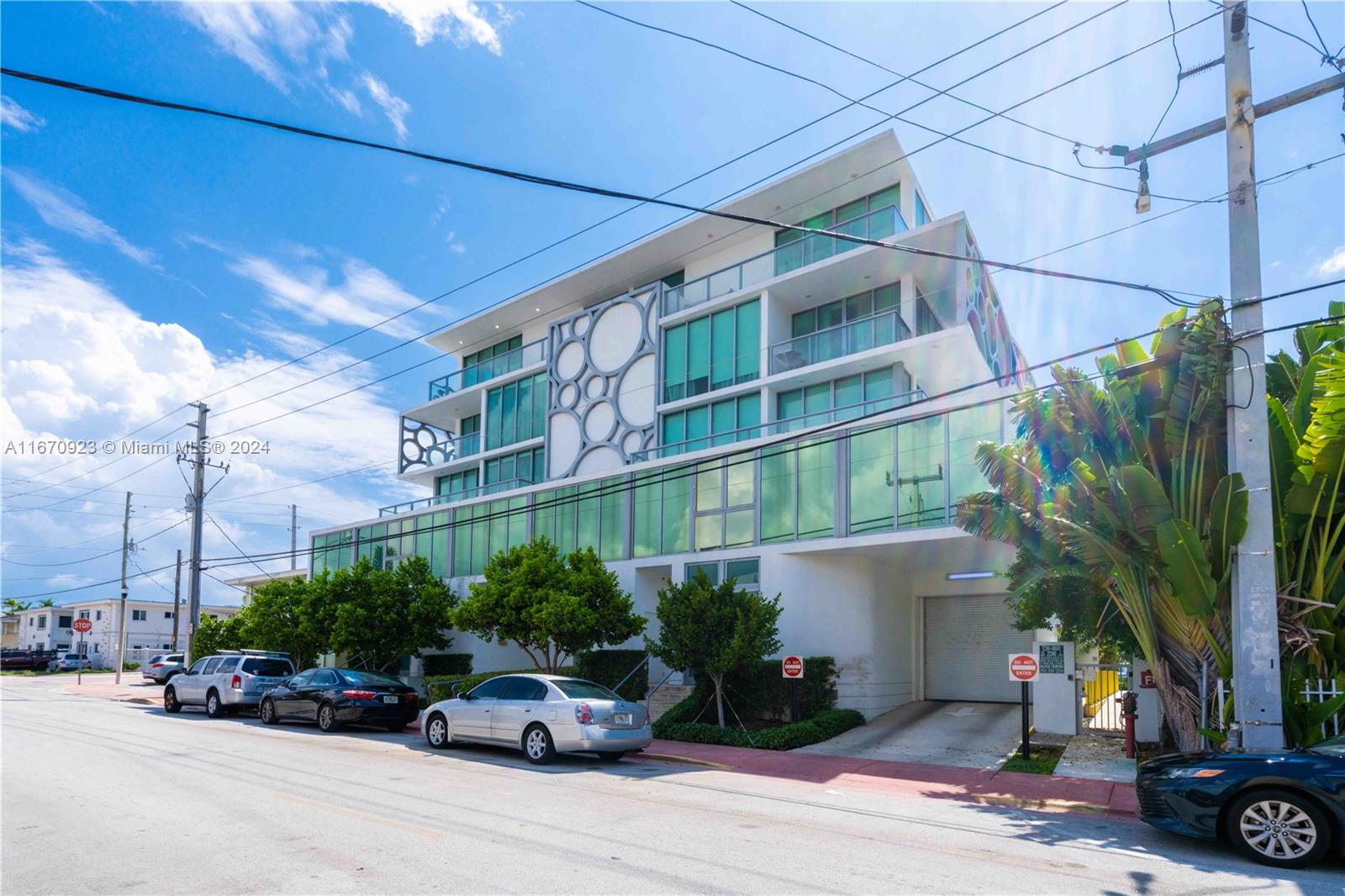 8425 Crespi Boulevard, Unit TH4 Miami Beach, FL 33141 - Photo 25 of 26 a car parked in front of a building