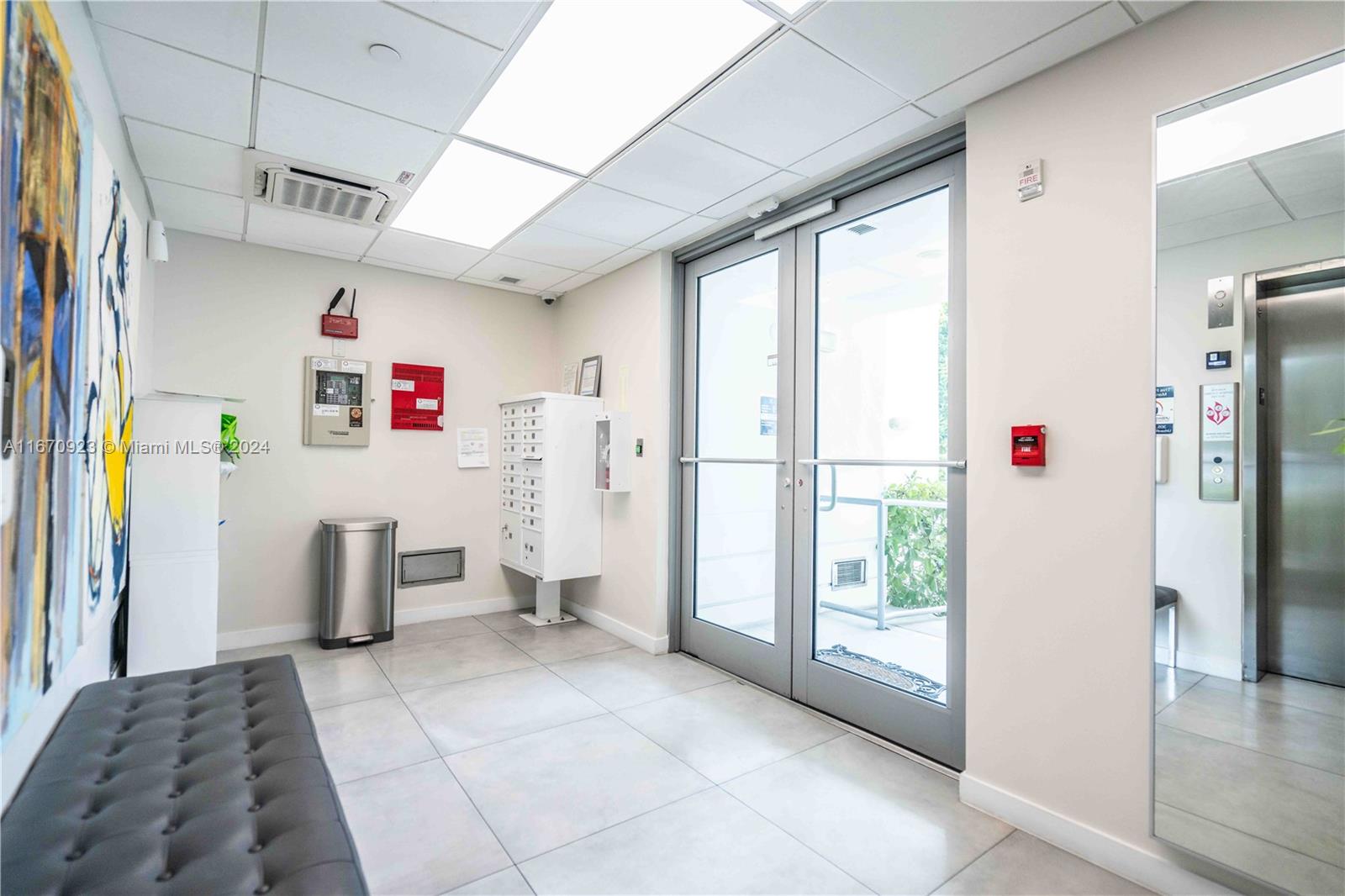 8425 Crespi Boulevard, Unit TH4 Miami Beach, FL 33141 - Photo 4 of 26 a kitchen with refrigerator and window