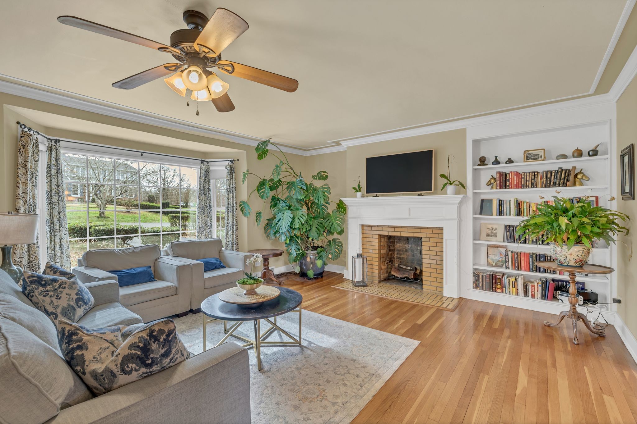 109 Audubon Road Shelbyville, TN 37160 - Photo 11 of 34 a living room with furniture a fireplace and a flat screen tv