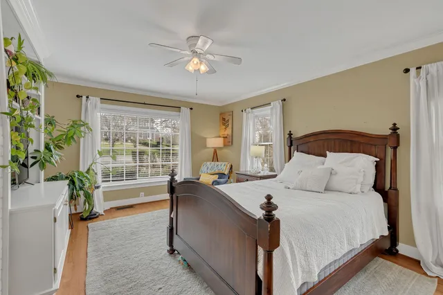 a bed room with a bed and a chandelier