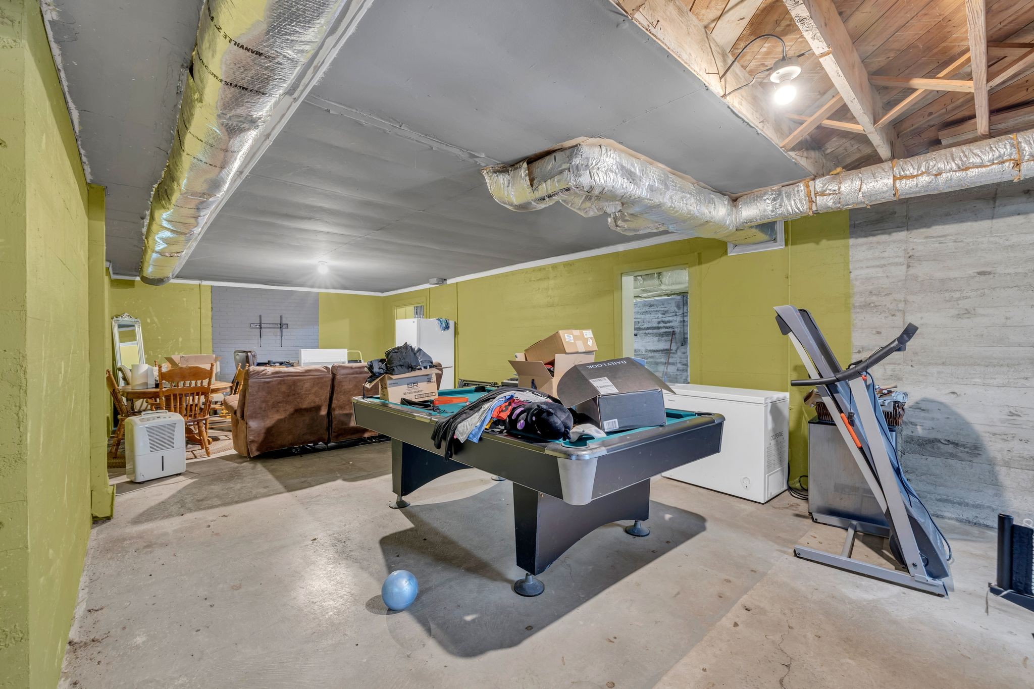 109 Audubon Road Shelbyville, TN 37160 - Photo 29 of 34 a living room with furniture and a chandelier