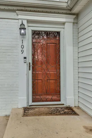 a view of a door and a window