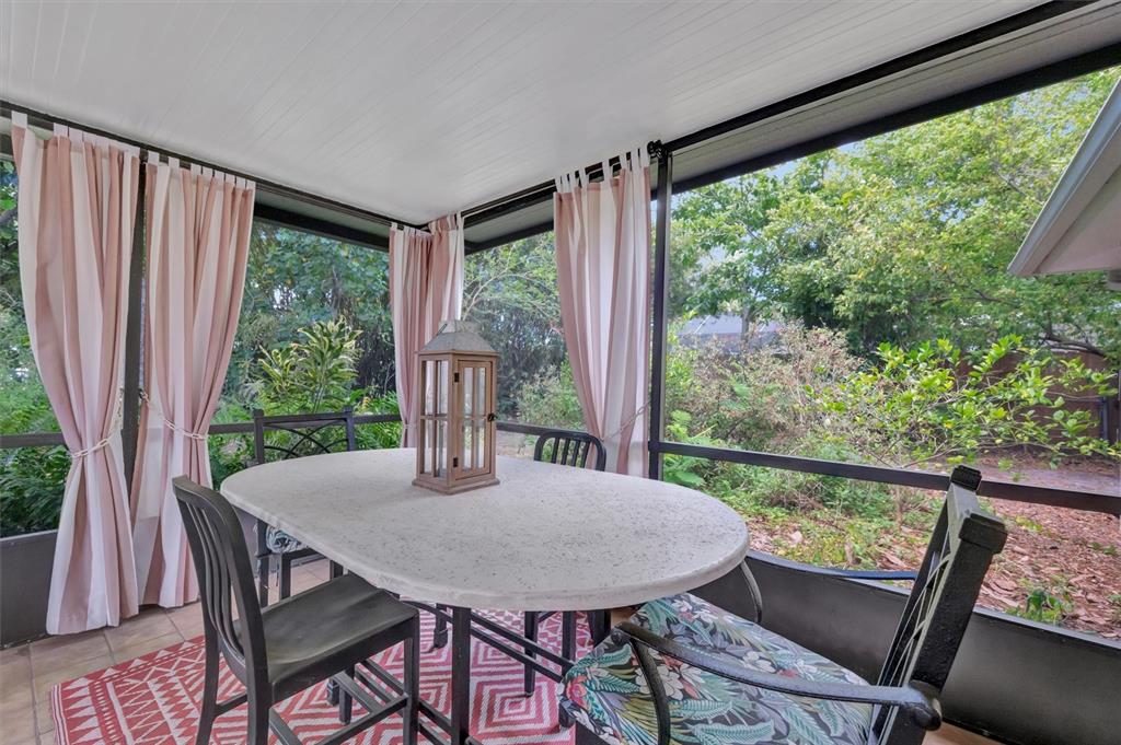 4478 Coco Ridge Circle Sarasota, FL 34233 - Photo 38 of 85 a view of a dining room with furniture window and wooden floor