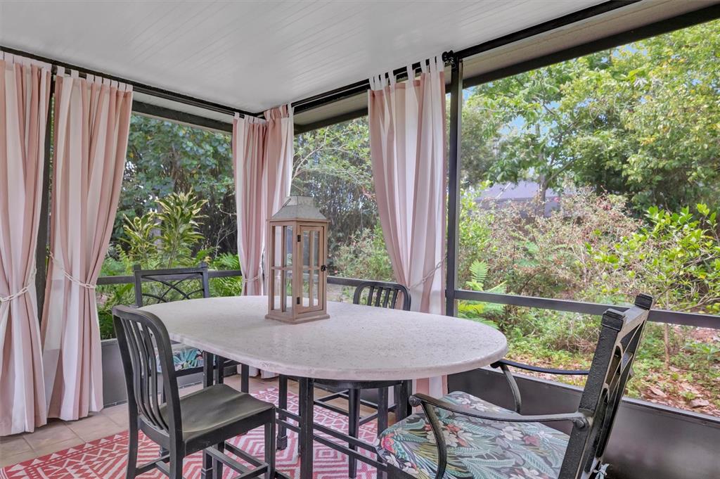 4478 Coco Ridge Circle Sarasota, FL 34233 - Photo 39 of 85 a view of a dining room with furniture and window