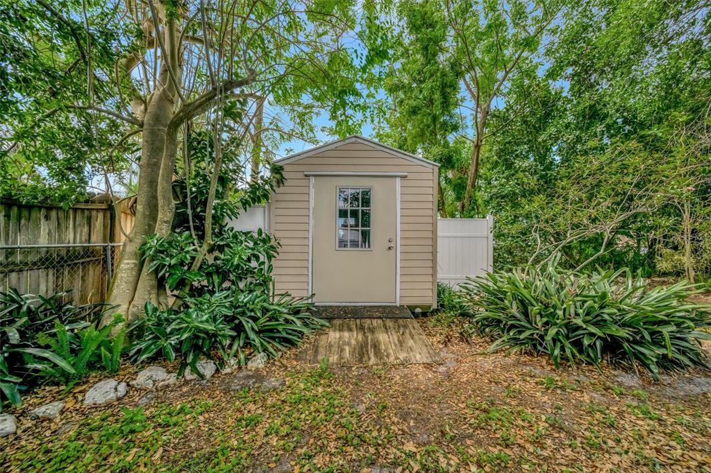4478 Coco Ridge Circle Sarasota, FL 34233 - Photo 69 of 85 a front view of a house with a yard and trees