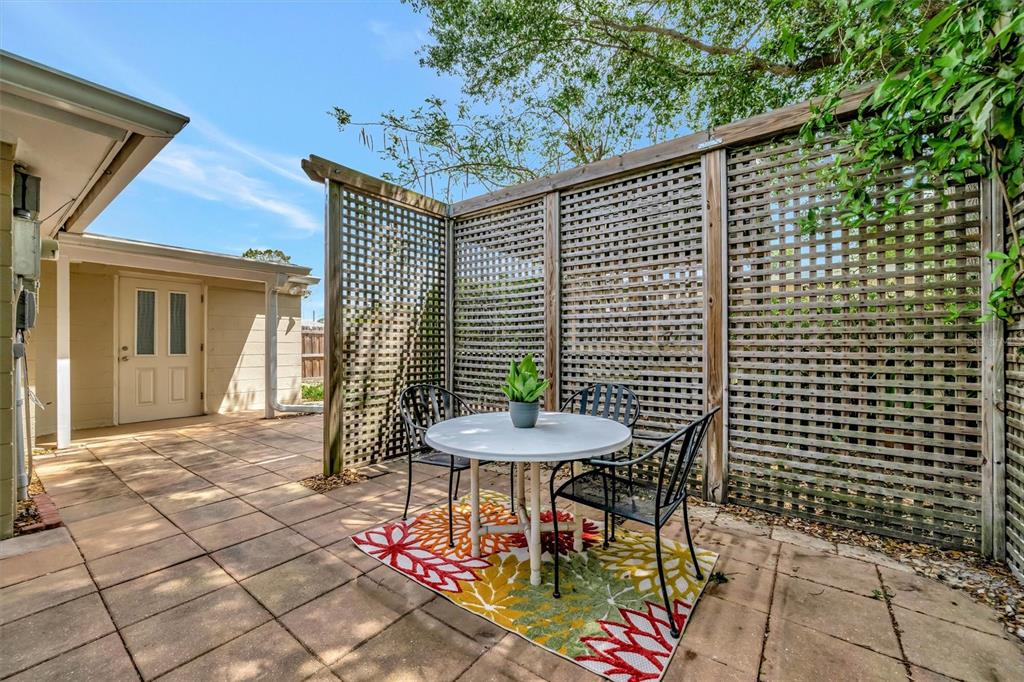4478 Coco Ridge Circle Sarasota, FL 34233 - Photo 78 of 85 a backyard of a house with outdoor seating