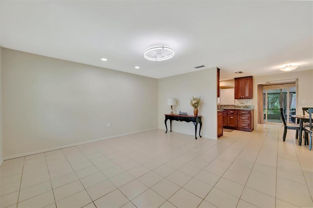 4478 Coco Ridge Circle Sarasota, FL 34233 - Photo 8 of 85 a view of a livingroom with furniture and a ceiling fan