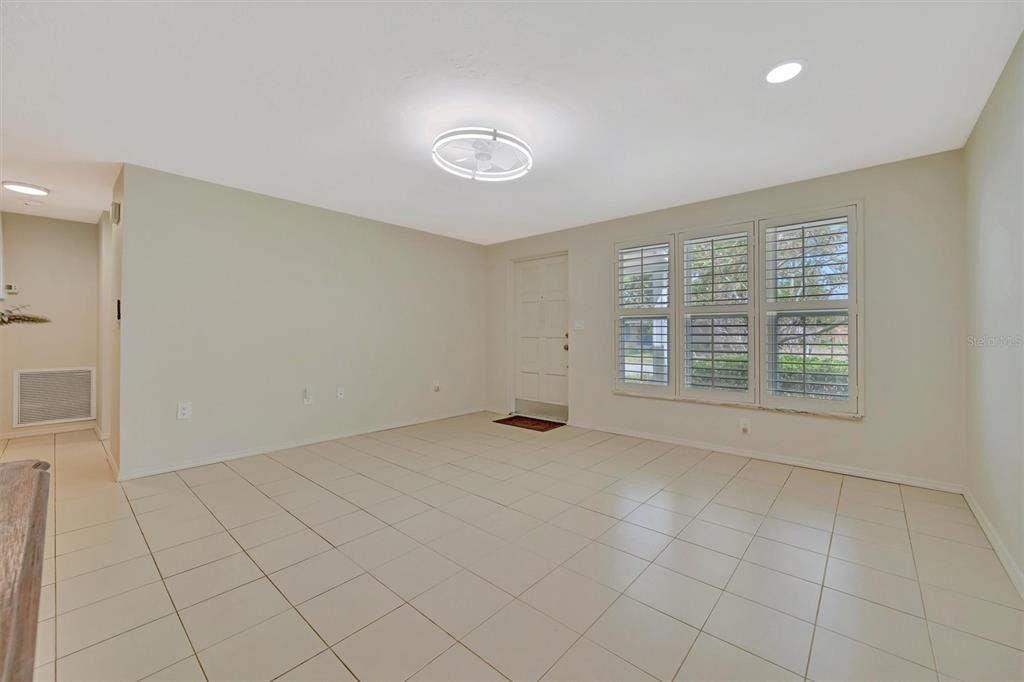 4478 Coco Ridge Circle Sarasota, FL 34233 - Photo 10 of 85 an empty room with windows