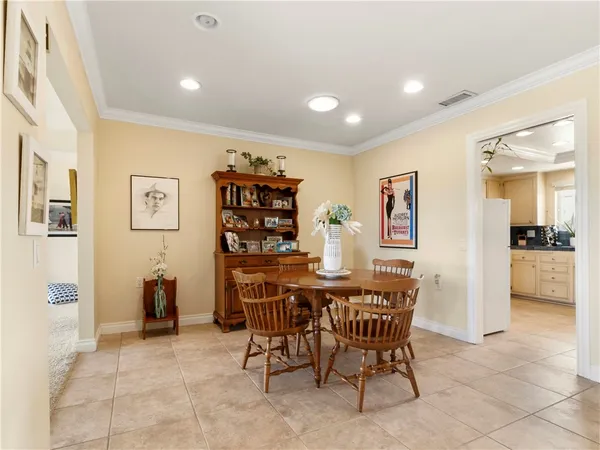 a dining room with furniture and window