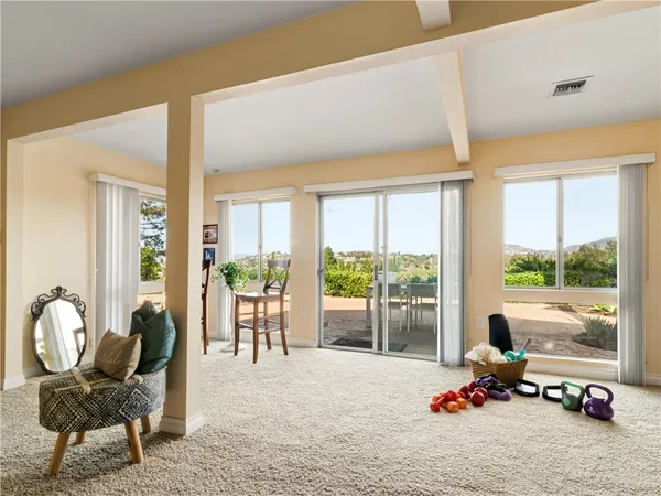 a room with furniture and a large window
