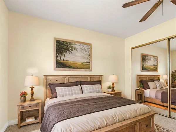 a bedroom with a bed and lamp