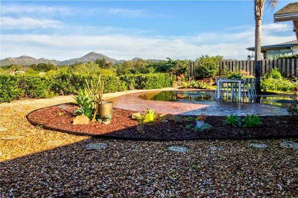 a view of a swimming pool with a garden
