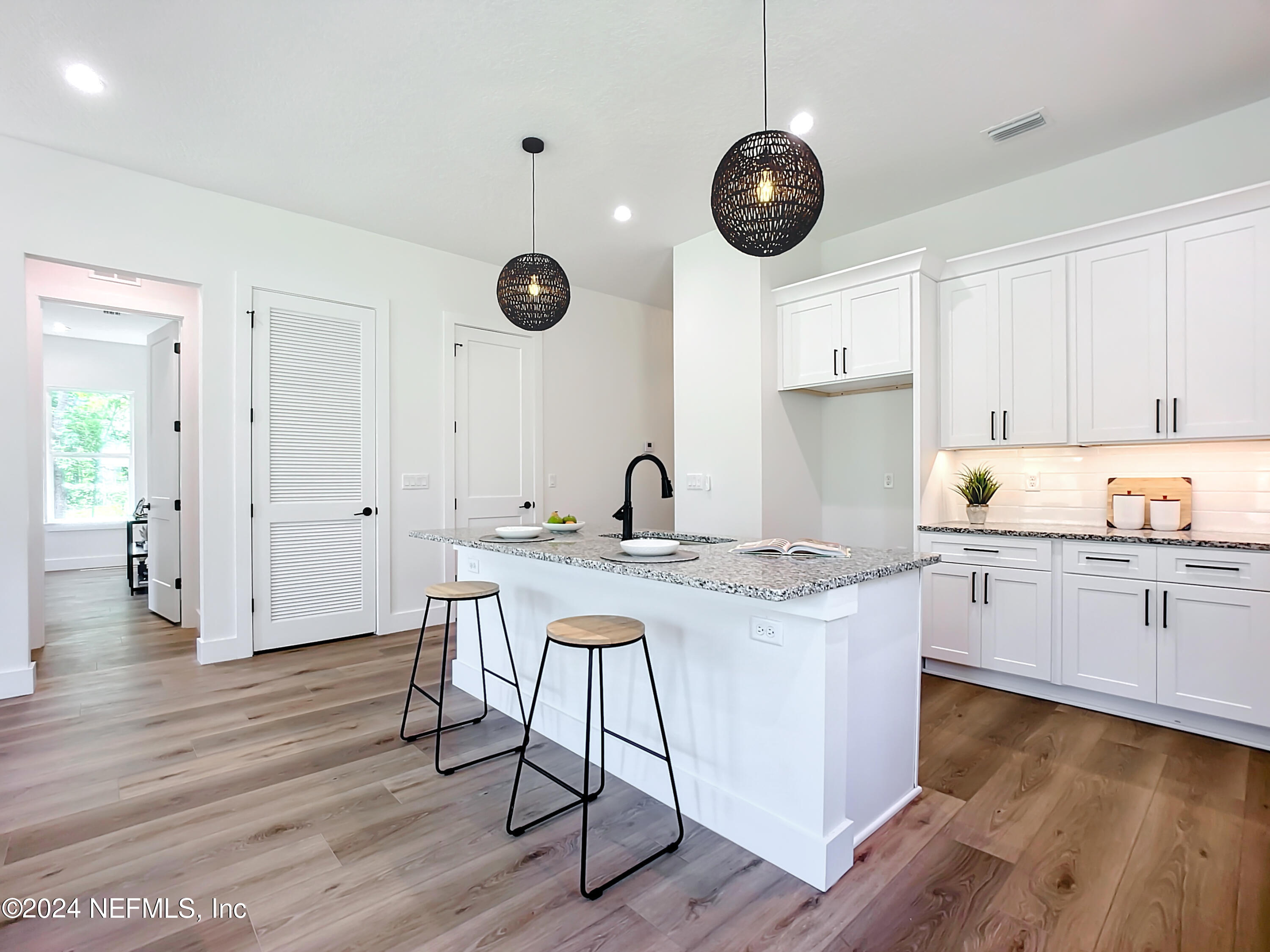 2909 Brougham Jacksonville, FL 32246 - Photo 9 of 46 a open kitchen with stainless steel appliances granite countertop a stove and a wooden floors