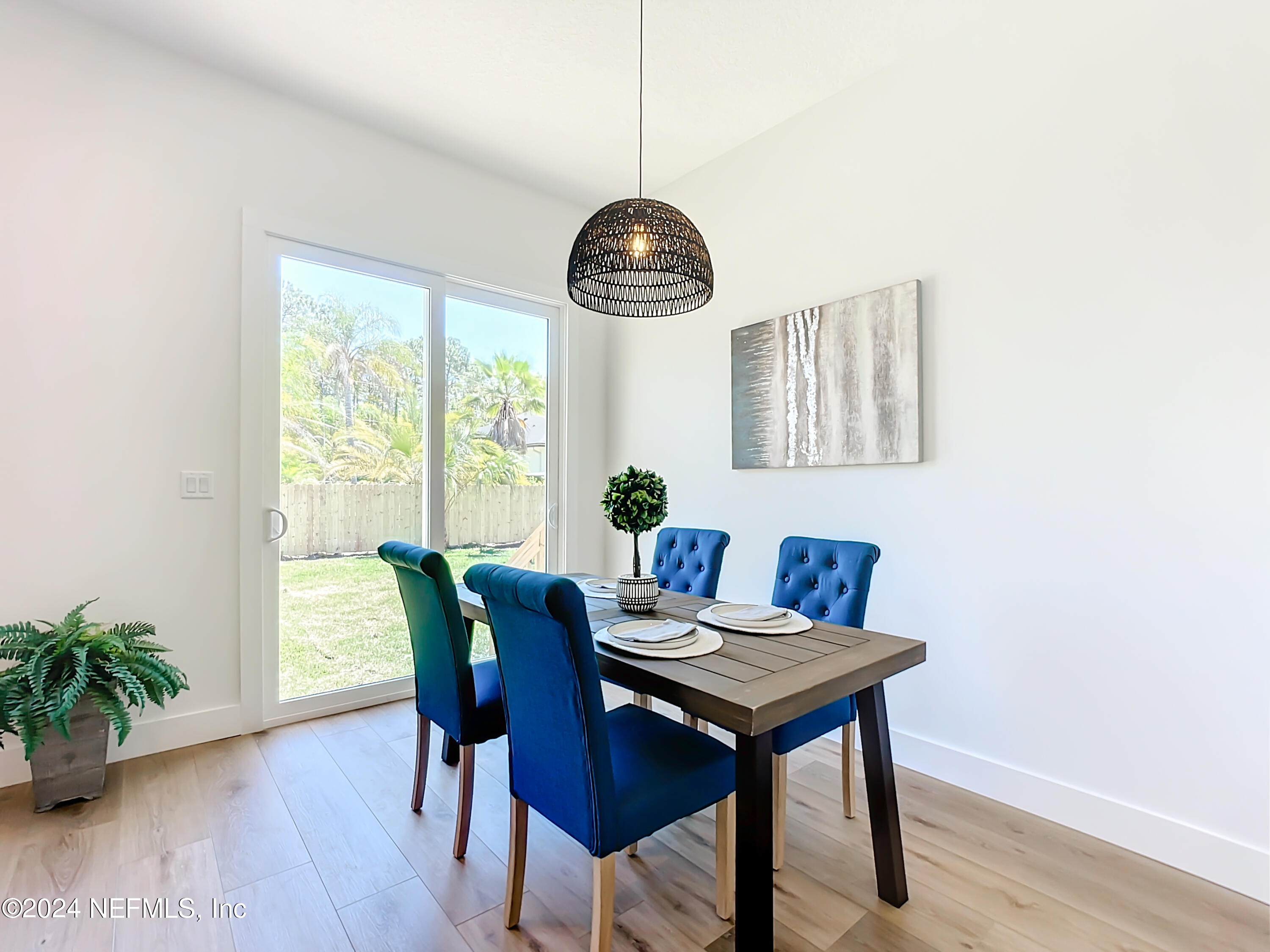 2909 Brougham Jacksonville, FL 32246 - Photo 14 of 46 a view of a dining room with furniture window and wooden floor