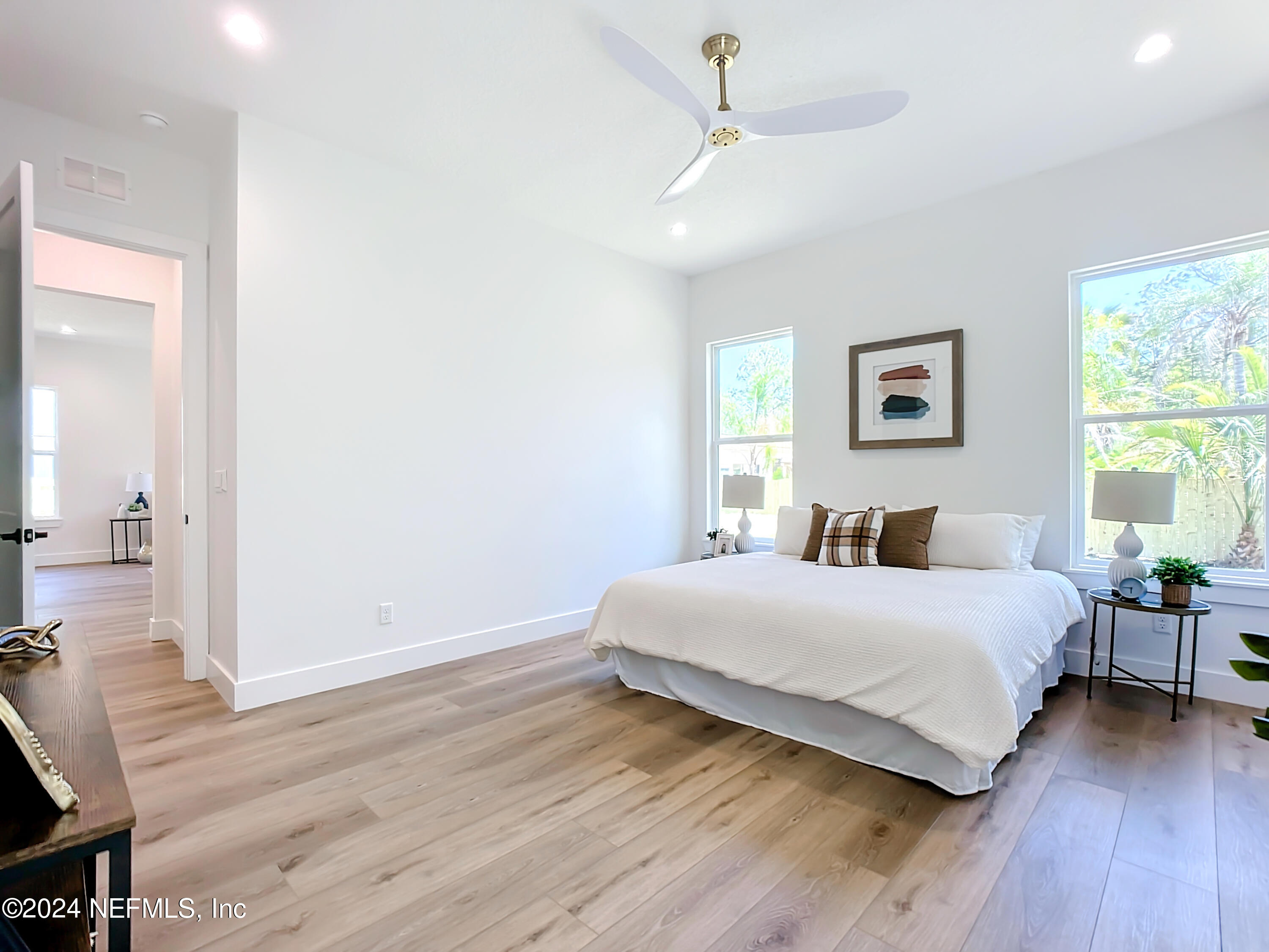 2909 Brougham Jacksonville, FL 32246 - Photo 15 of 46 a bedroom with a bed and wooden floor