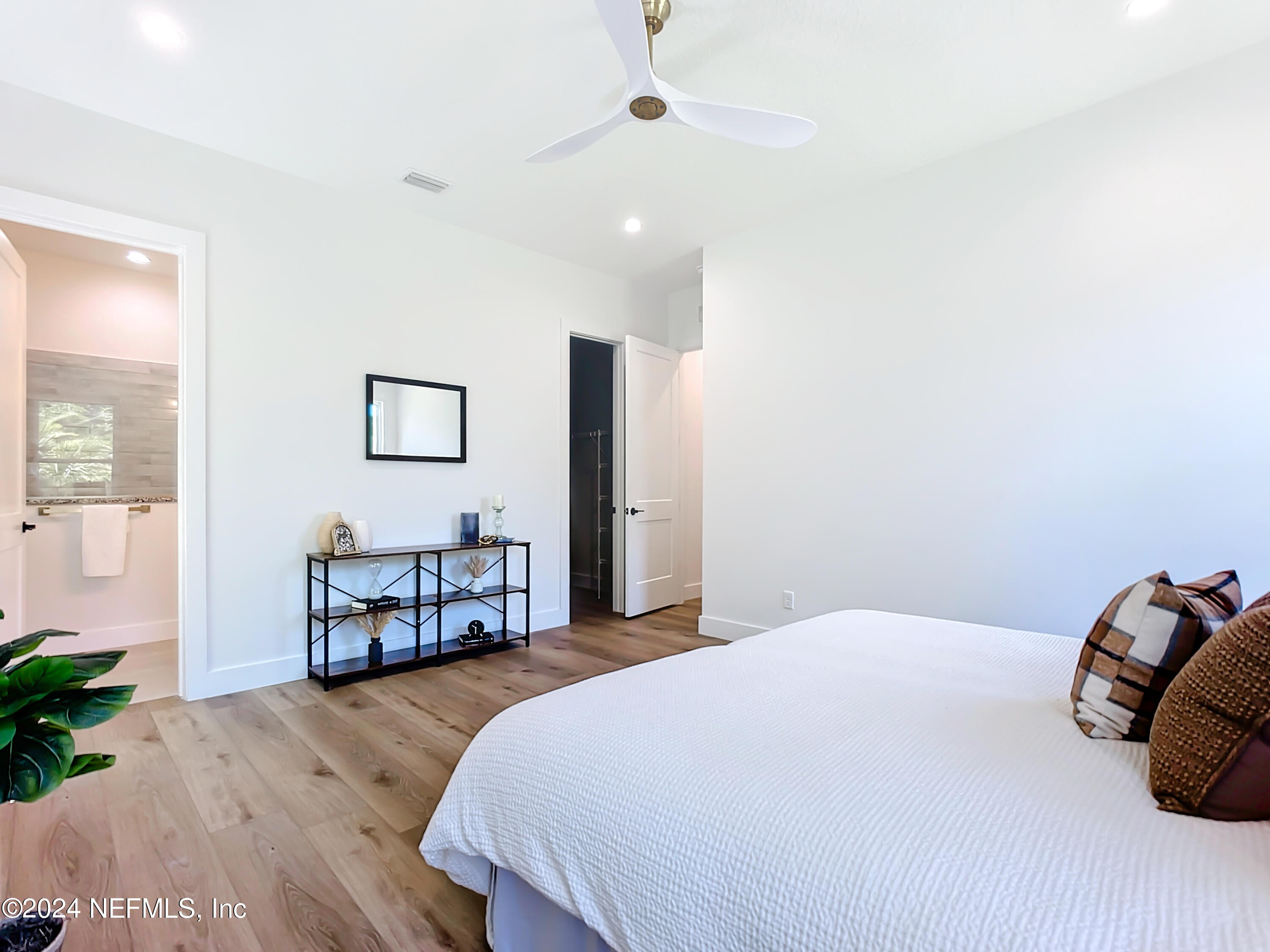 2909 Brougham Jacksonville, FL 32246 - Photo 18 of 46 a bedroom with a bed and wooden floor