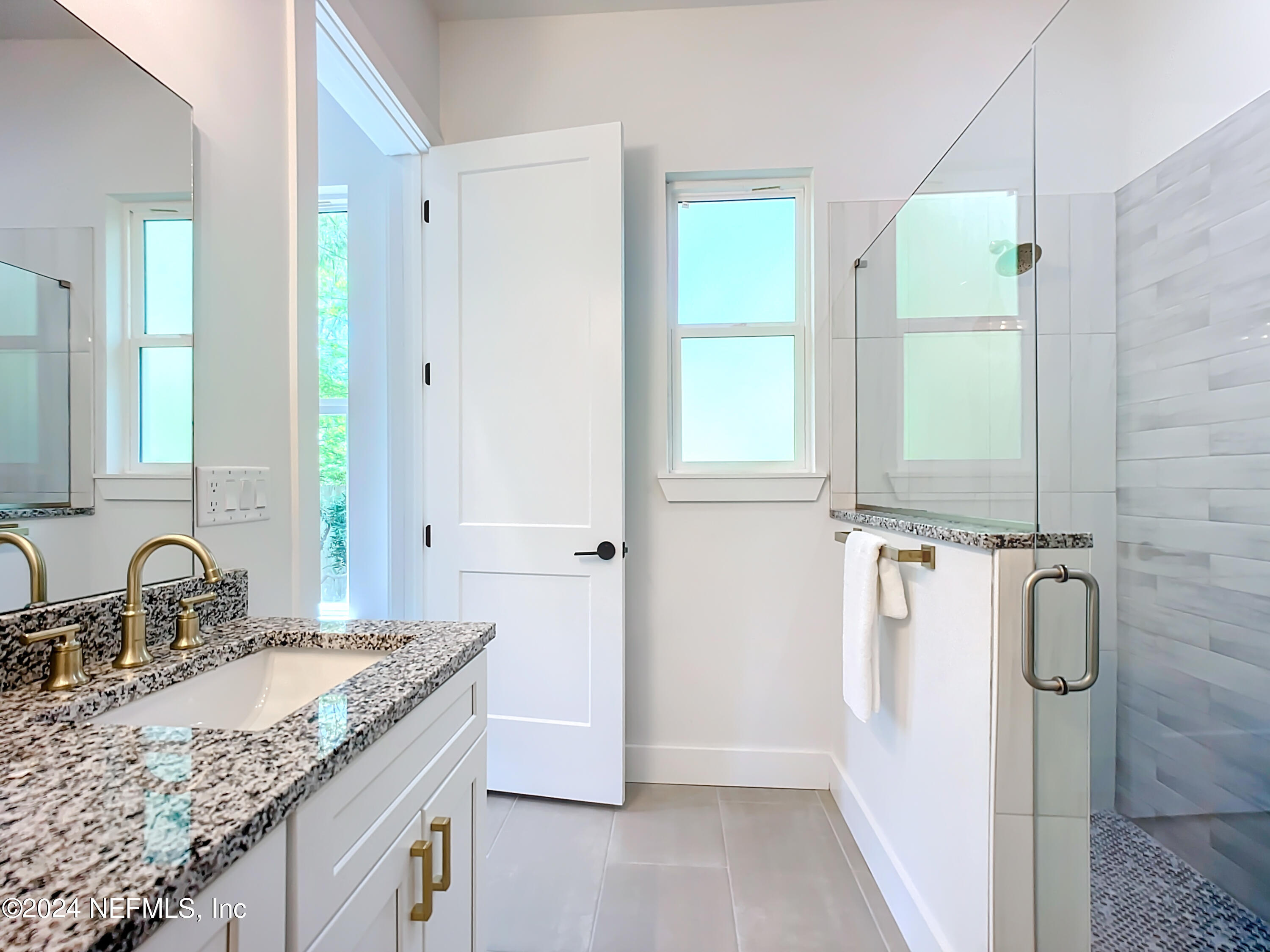2909 Brougham Jacksonville, FL 32246 - Photo 19 of 46 a bathroom with a granite countertop sink and a mirror