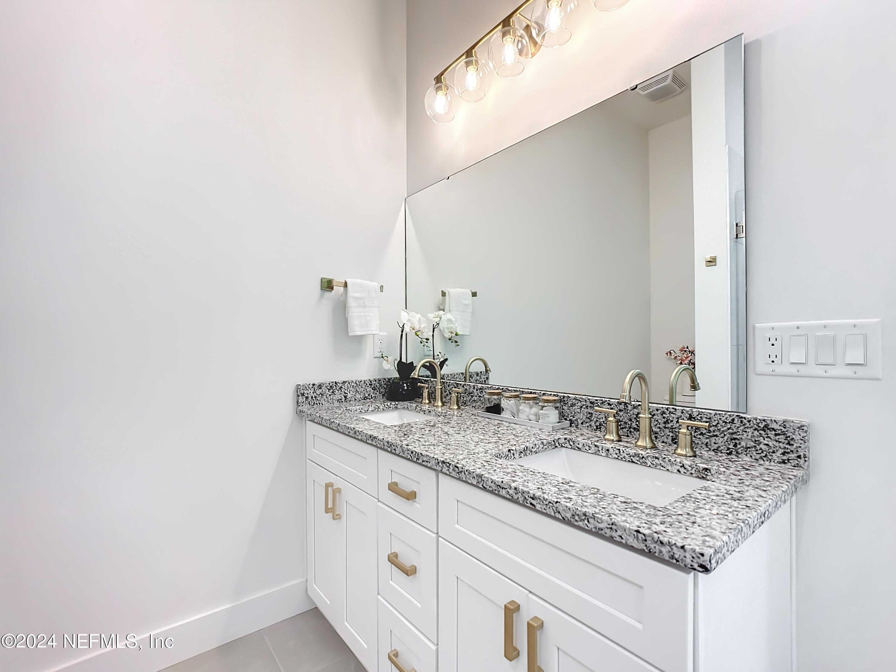 2909 Brougham Jacksonville, FL 32246 - Photo 21 of 46 a bathroom with a granite countertop sink and a mirror