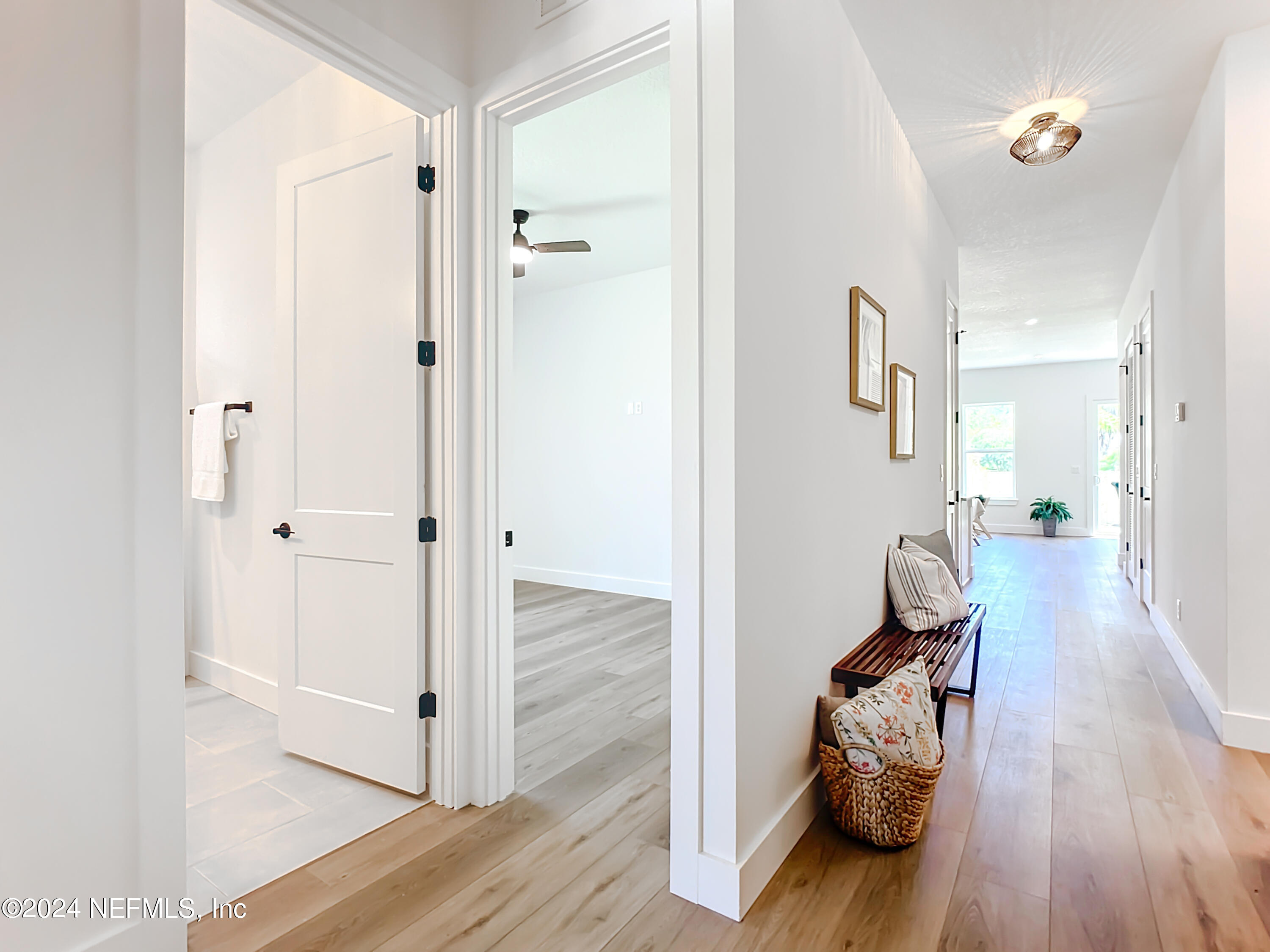 2909 Brougham Jacksonville, FL 32246 - Photo 23 of 46 a view of a hallway with wooden floor and furniture
