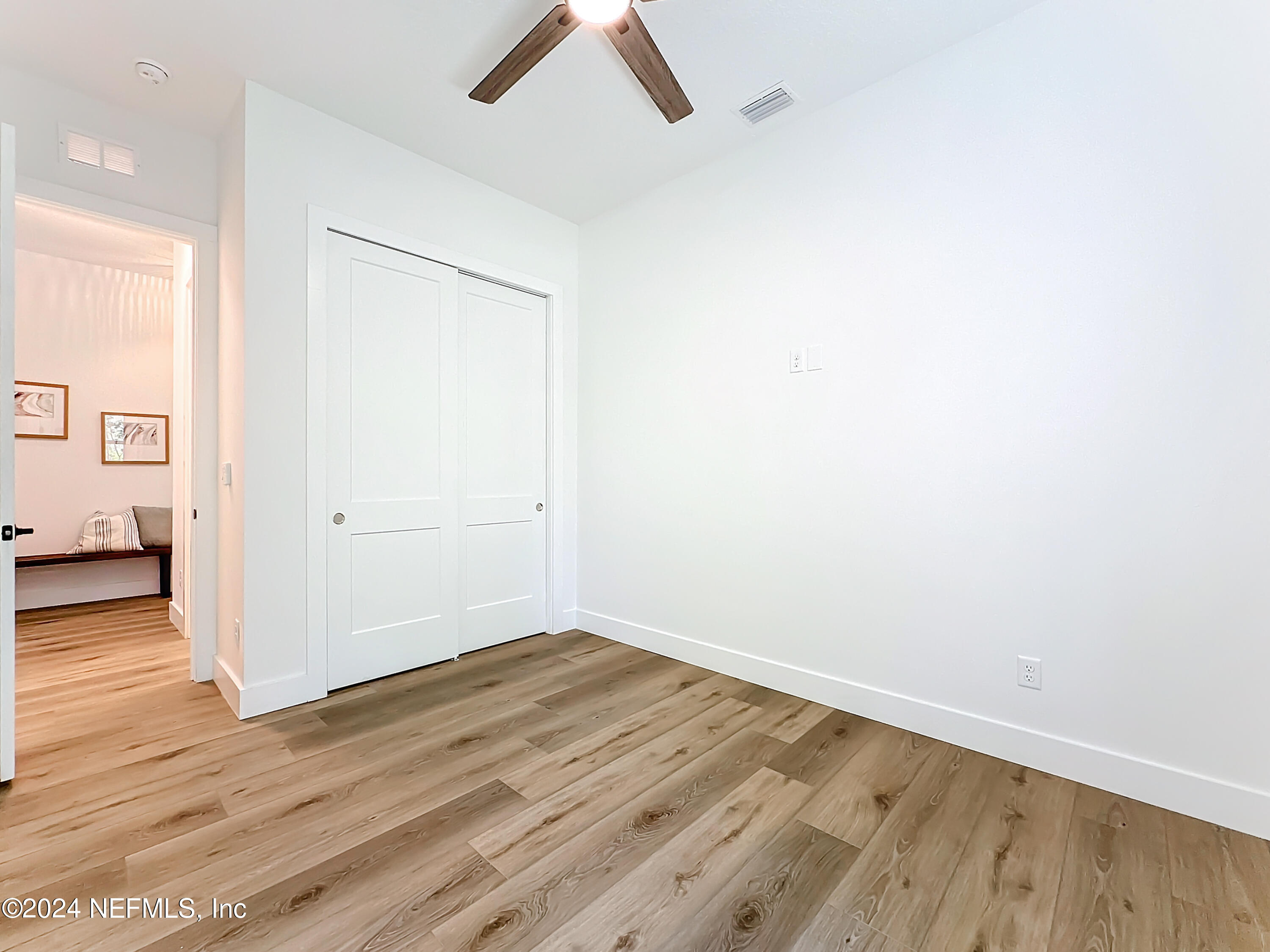 2909 Brougham Jacksonville, FL 32246 - Photo 24 of 46 an empty room with wooden floor and windows