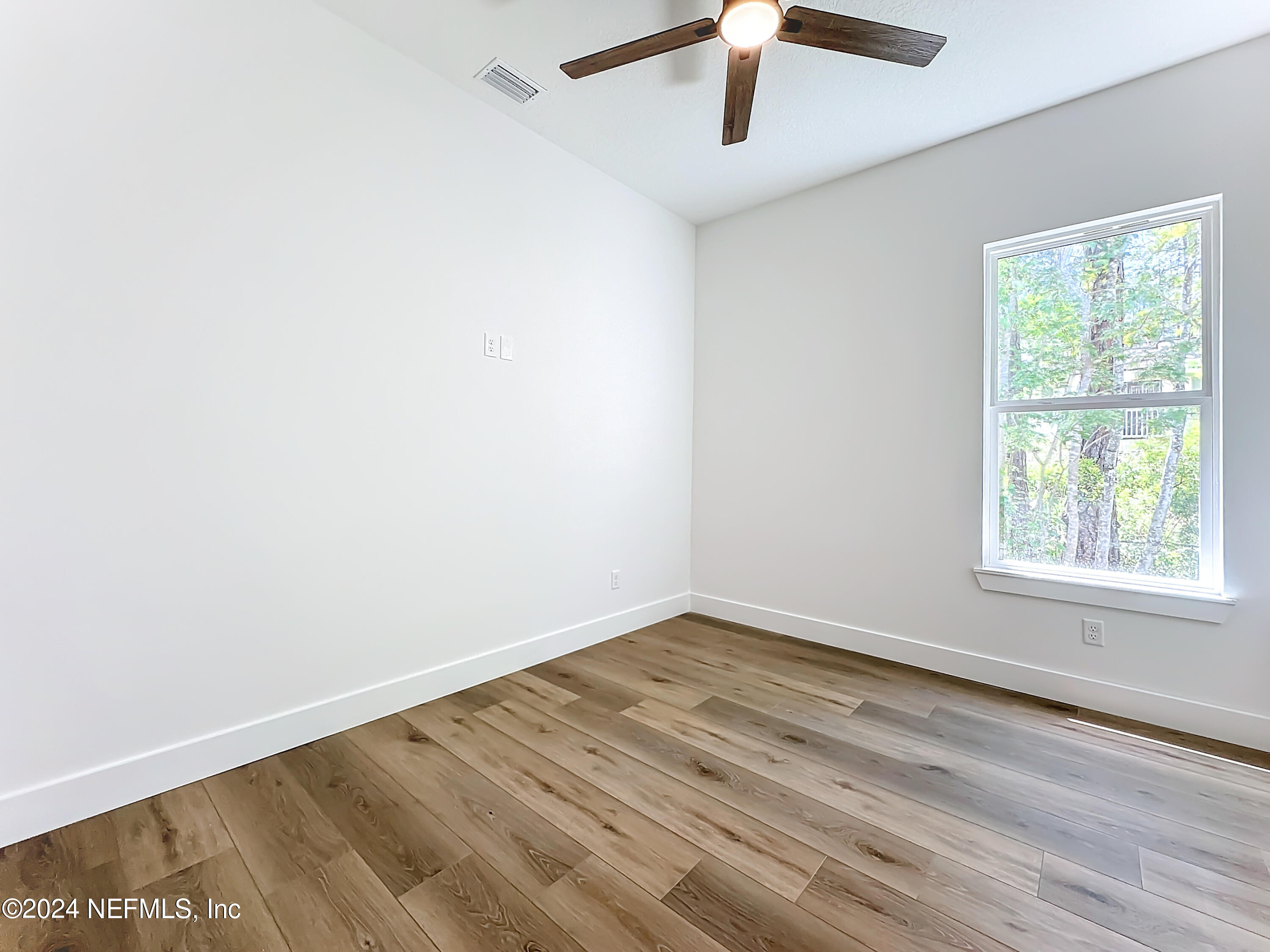 2909 Brougham Jacksonville, FL 32246 - Photo 25 of 46 an empty room with a window and a ceiling fan