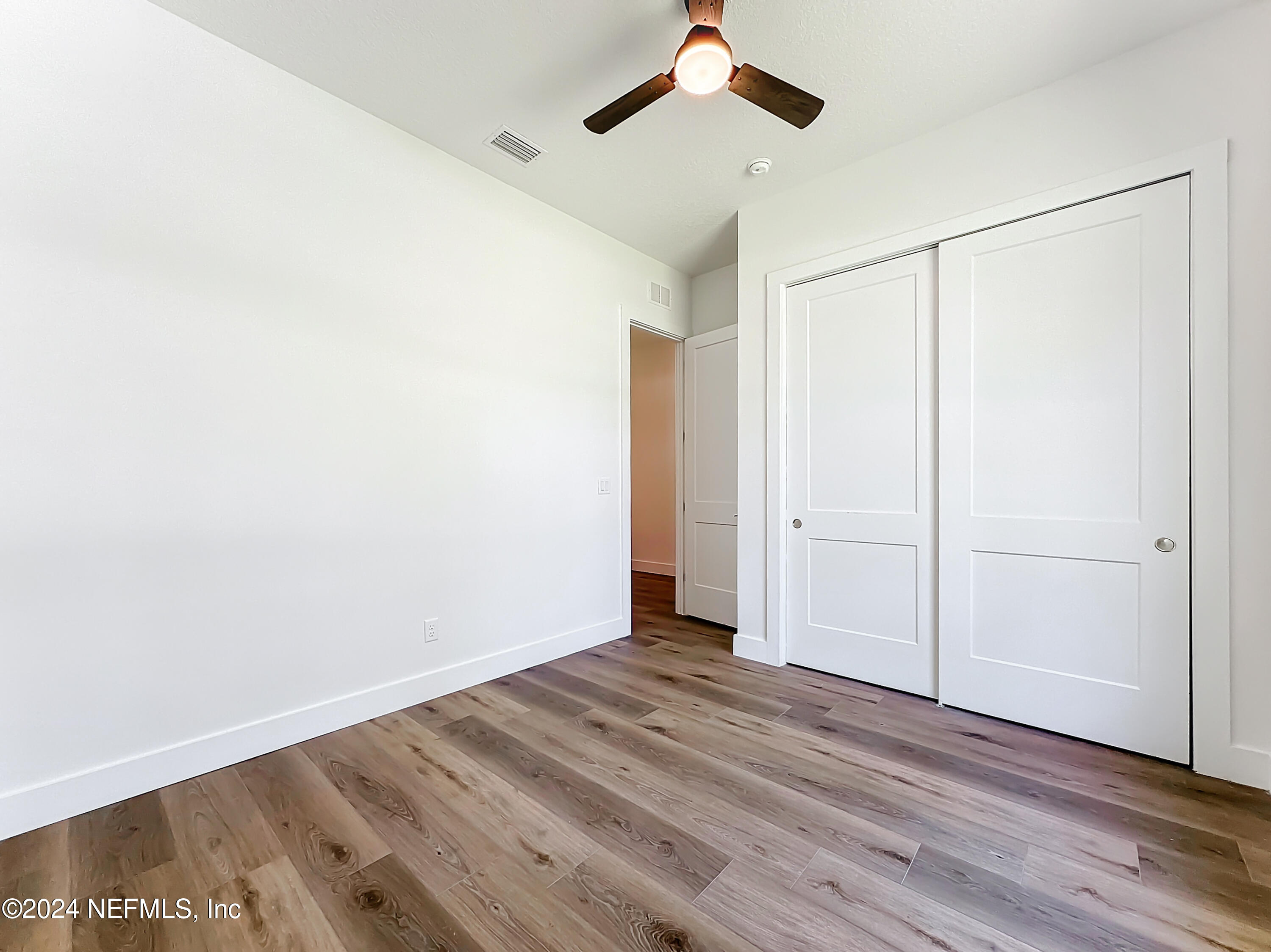 2909 Brougham Jacksonville, FL 32246 - Photo 26 of 46 a view of a room with wooden floor