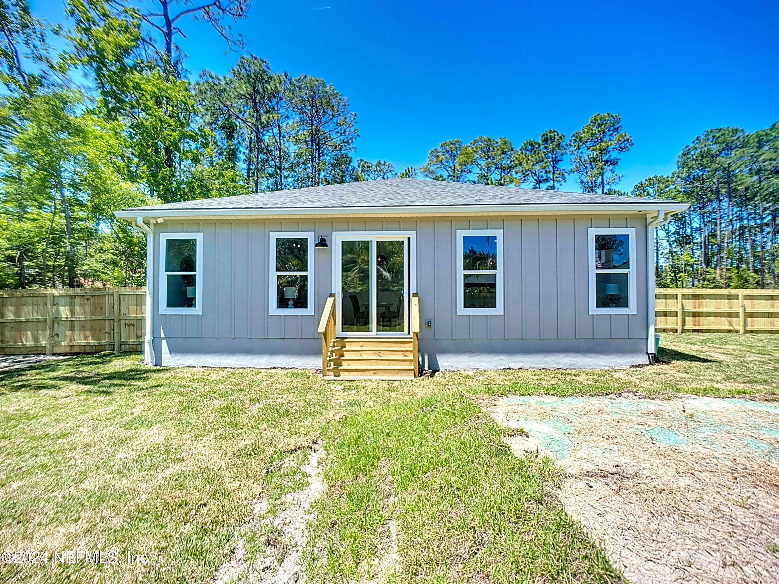 2909 Brougham Jacksonville, FL 32246 - Photo 32 of 46 a house that has a tree in front of it