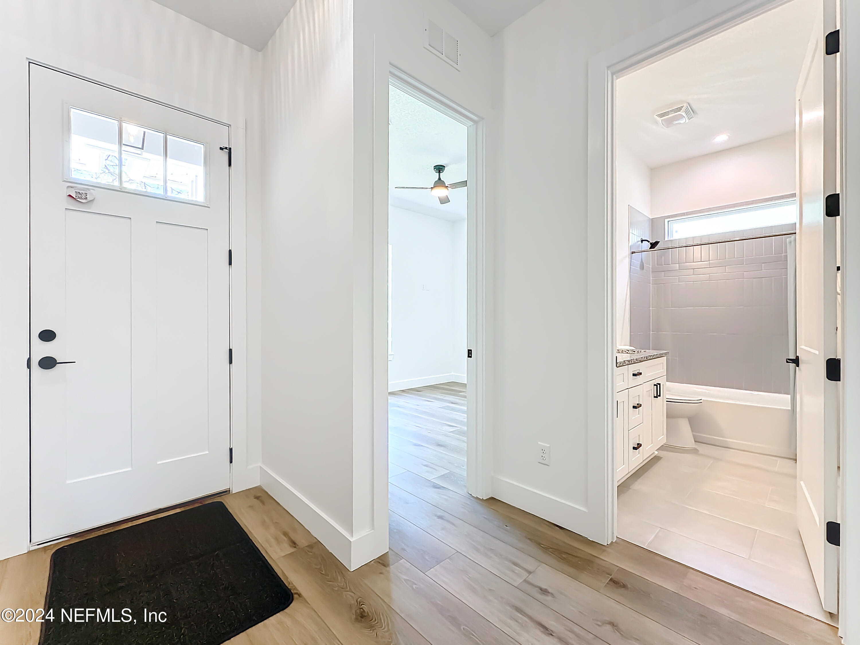 2909 Brougham Jacksonville, FL 32246 - Photo 4 of 46 wooden floor with white walls