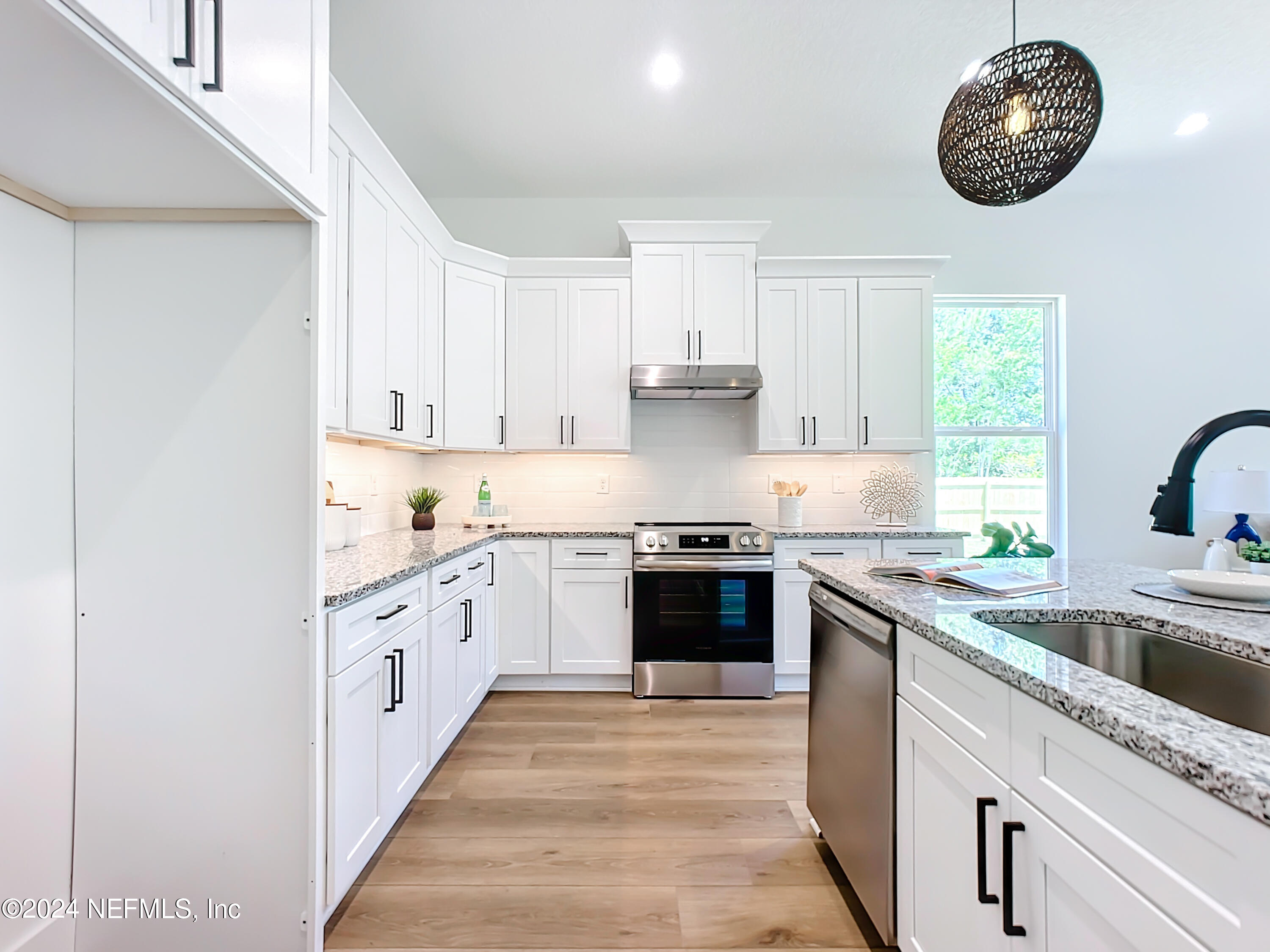 2909 Brougham Jacksonville, FL 32246 - Photo 6 of 46 a large kitchen with stainless steel appliances granite countertop a stove and a sink