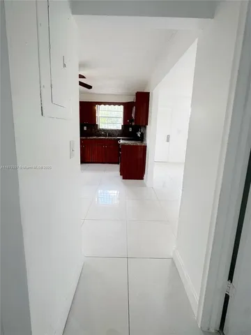a kitchen with cabinets and white appliances