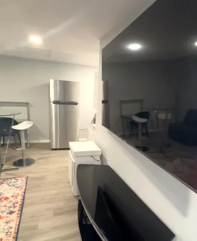 a kitchen with a sink cabinets and refrigerator