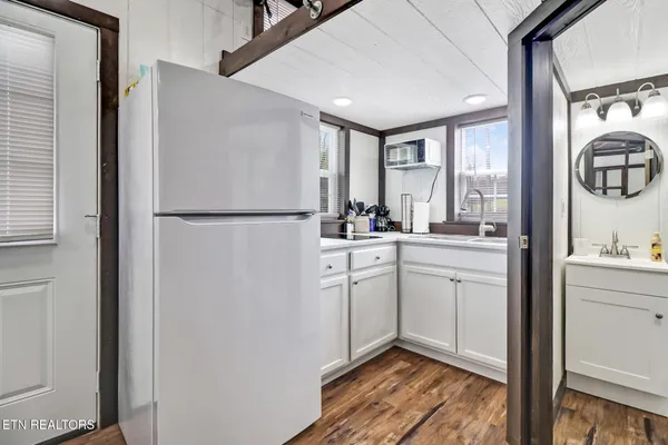 a kitchen with a sink and a window