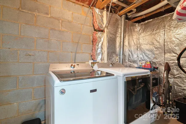 a utility room with a sink and cabinets