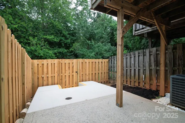 a view of outdoor space with wooden fence