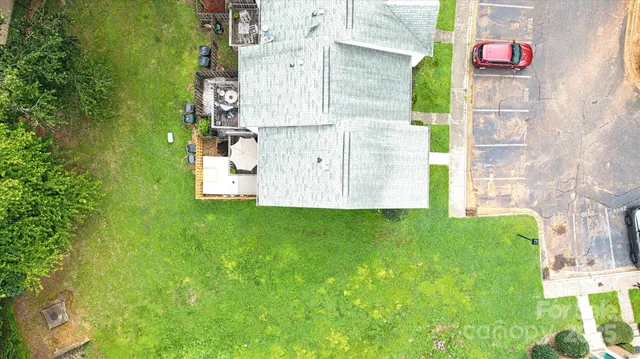 an aerial view of residential house with outdoor space and trees