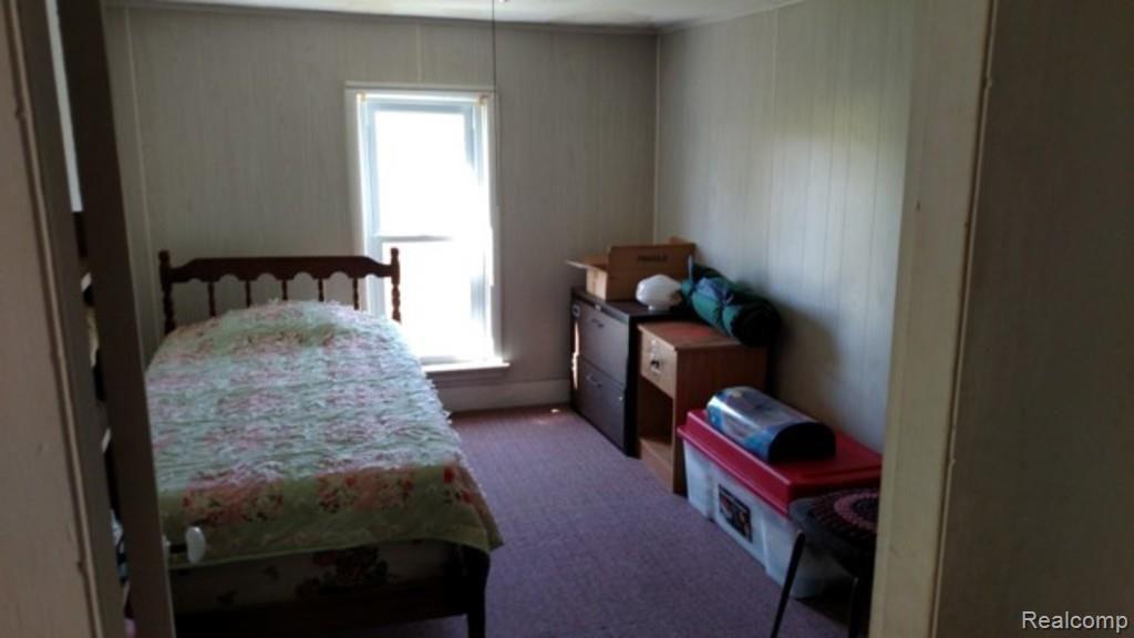 9183 Metcalf Road Avoca, MI 48006 - Photo 10 of 18 This is a view of one of the upstairs bedrooms.