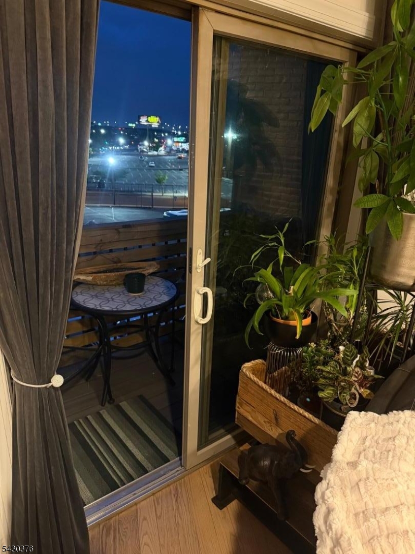 15 Tichenor Street, Unit 405 Newark, NJ 07114 - Photo 17 of 20 a room with lots of potted plants