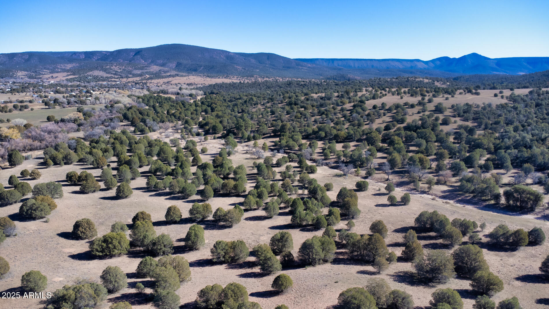 360 Barracks Road, Unit A Young, AZ 85554 - Photo 13 of 17 an aerial view of a city and mountain