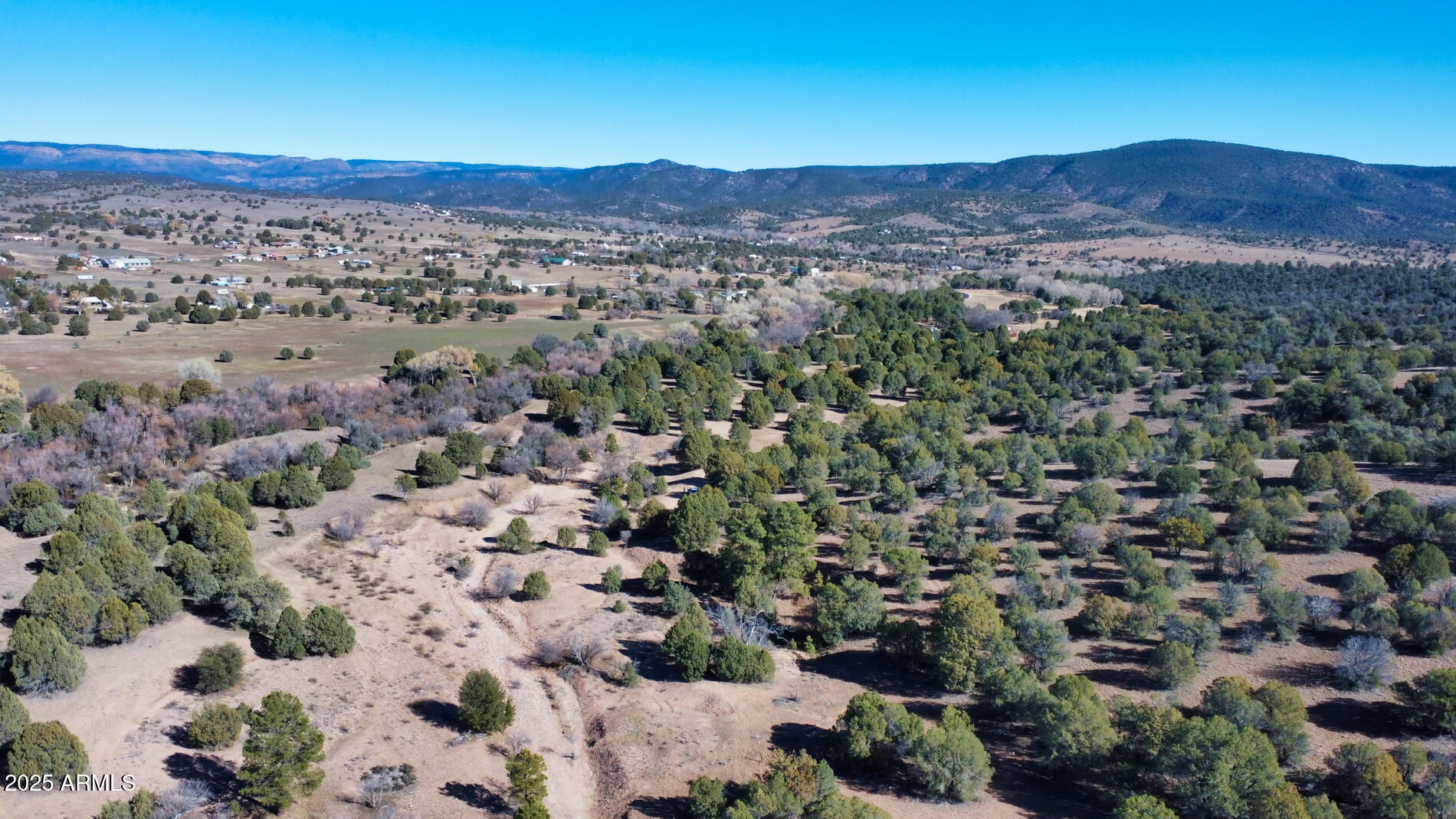 360 Barracks Road, Unit A Young, AZ 85554 - Photo 16 of 17 a view of a city with mountains in the background