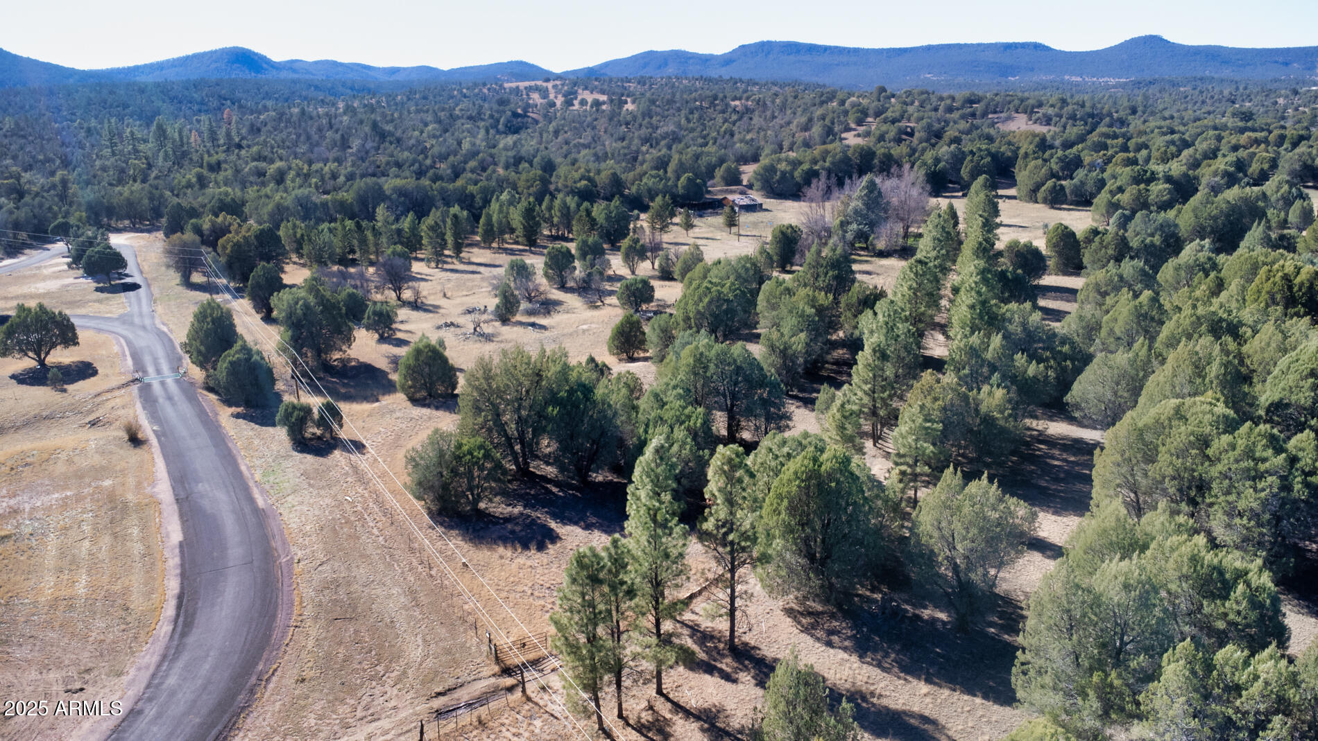 360 Barracks Road, Unit A Young, AZ 85554 - Photo 2 of 17 a view of a city with lush green forest