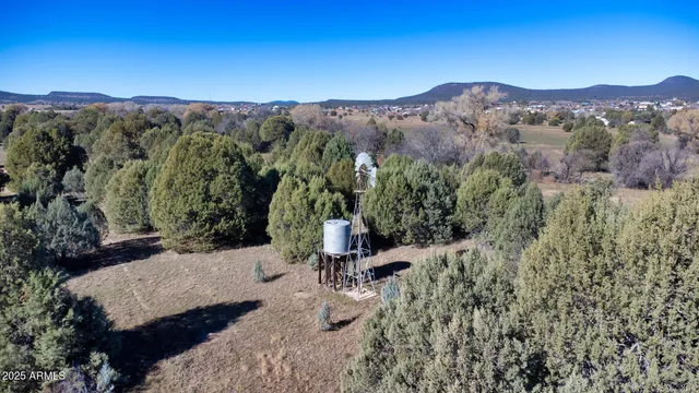 a view of a mountain with a mountain in the background