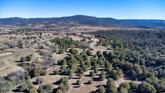 an aerial view of residential house and sandy dunes
